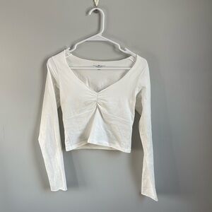 white, slightly cropped, v-neck long sleeve